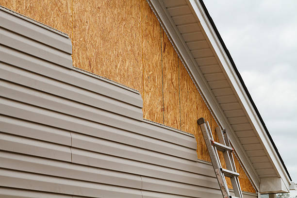 Professional Storm Damage Siding Repair technician working in Elon, NC